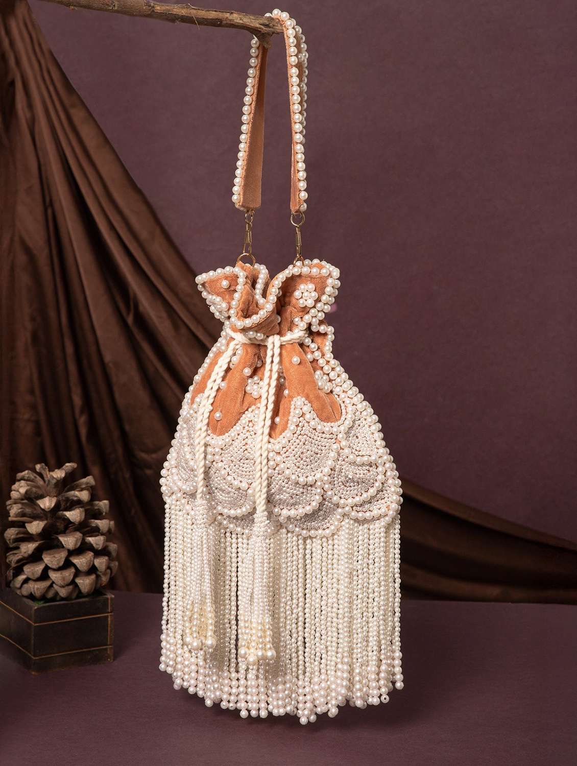embroidered pearl velvet potli with tassels