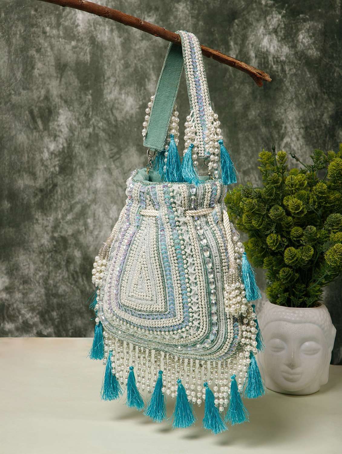 ethnic embroidered velvet potli with tassels 