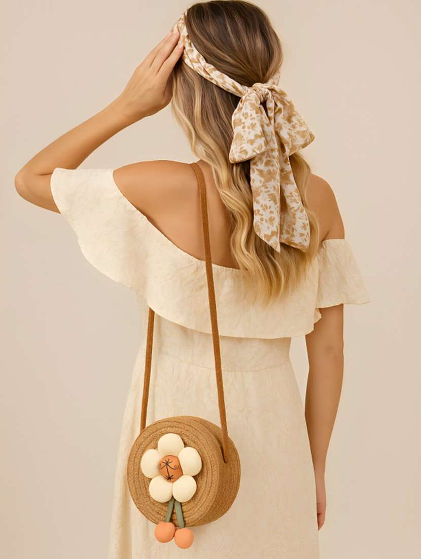 brown jute sling bag with plush flower - 22225215 -  Standard Image - 1