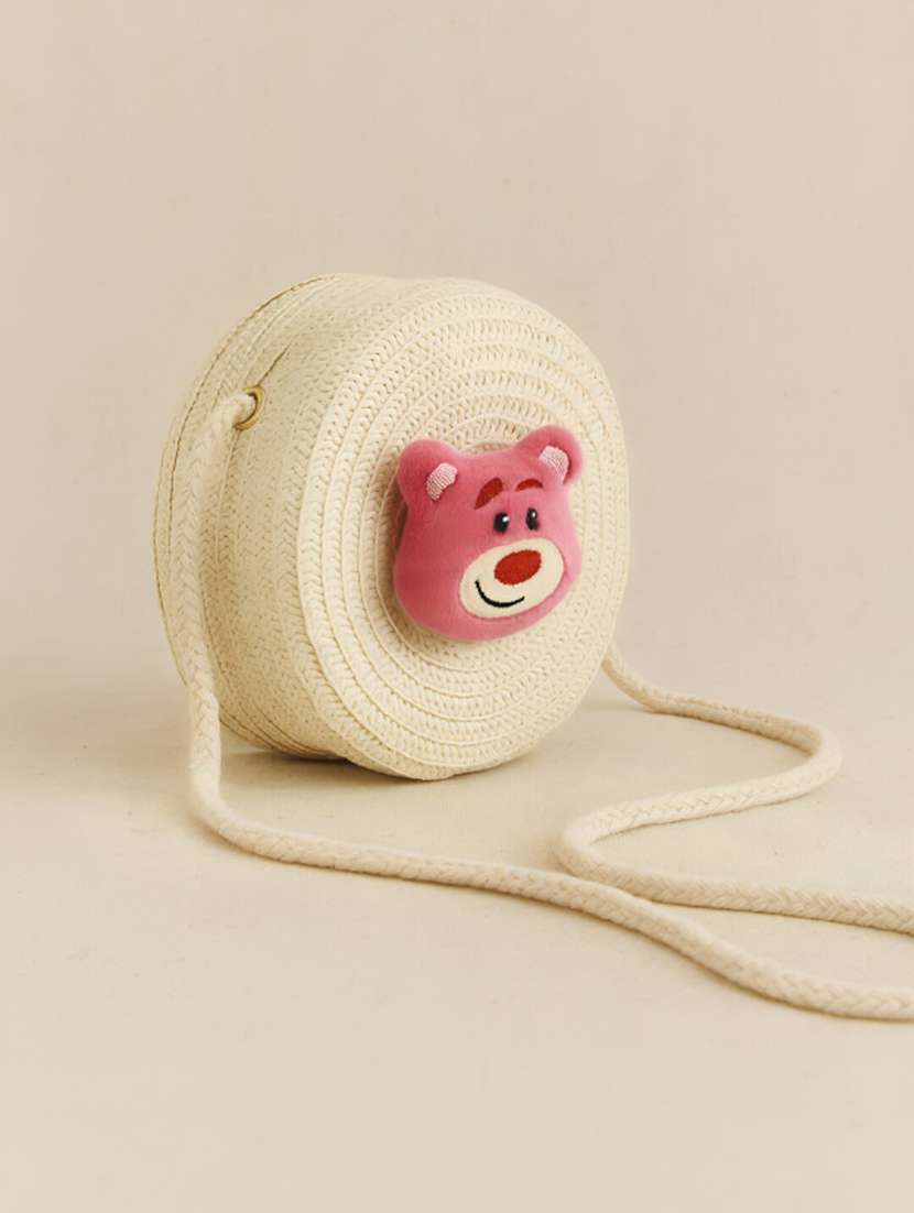 women round white jute sling bag