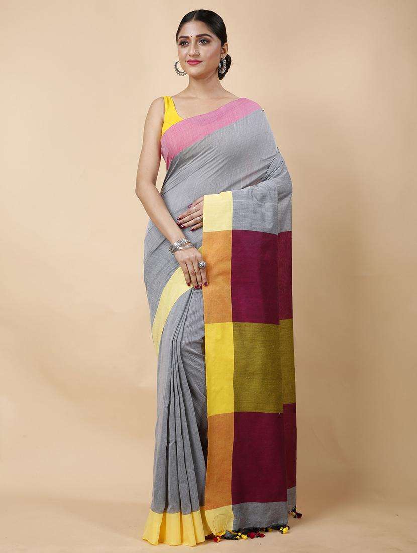 women solid with bordered handloom saree