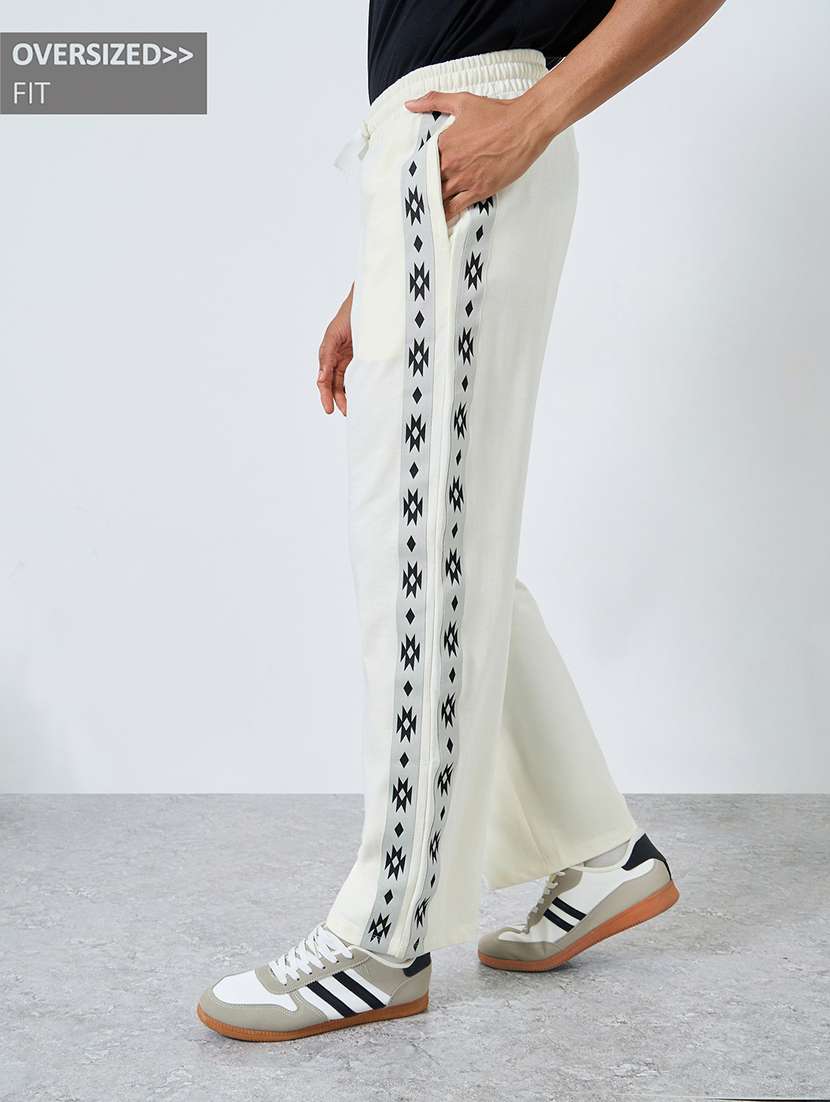 men solid mid rise relaxed fit track pant - 22287904 -  Standard Image - 1