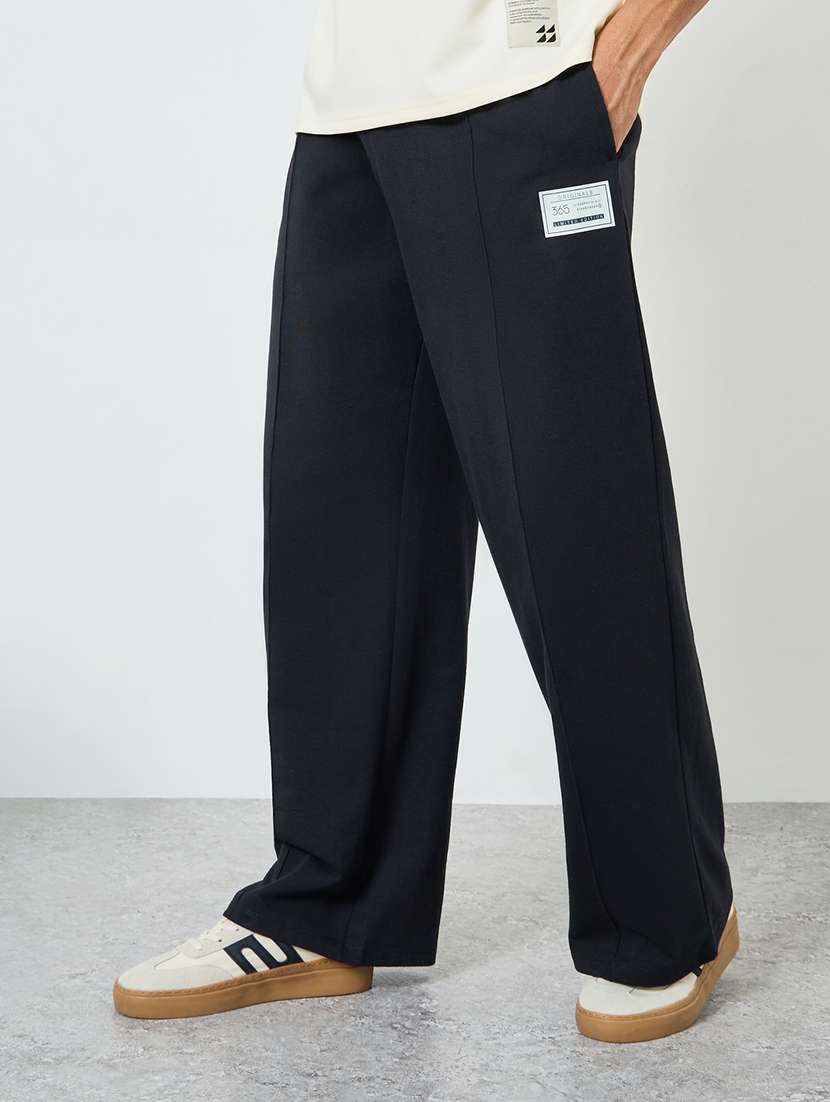 men solid mid rise relaxed fit track pant