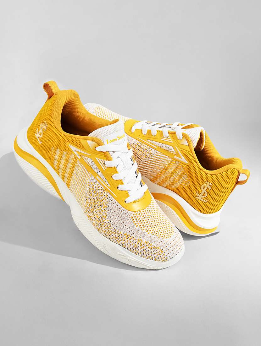 women yellow lace-up sports shoe