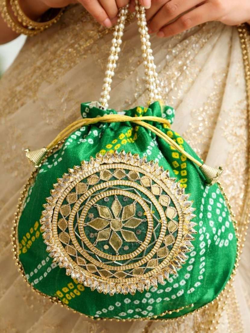 women embellsihed potli bag - 22373604 -  Standard Image - 1