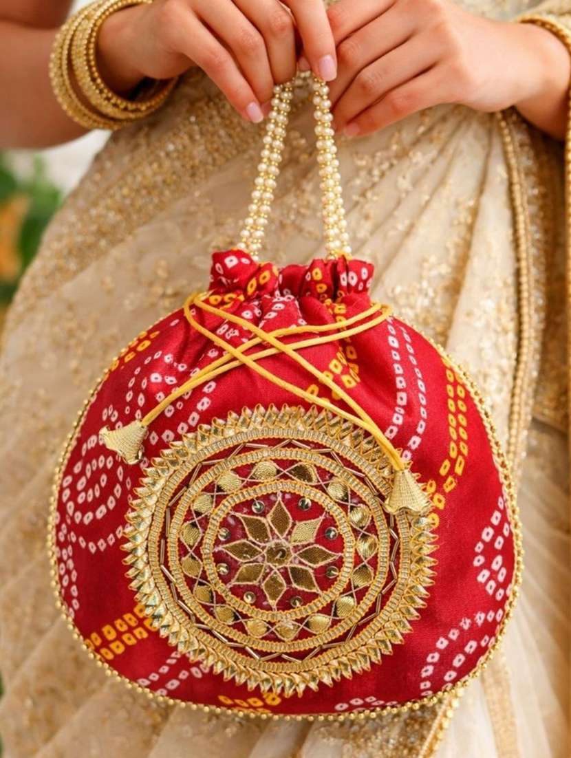 women embellsihed potli bag - 22373605 -  Standard Image - 1