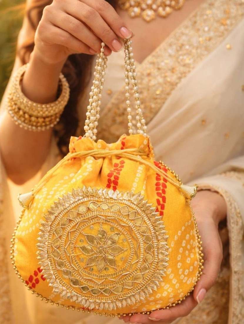 women embellsihed potli bag - 22373606 -  Standard Image - 1
