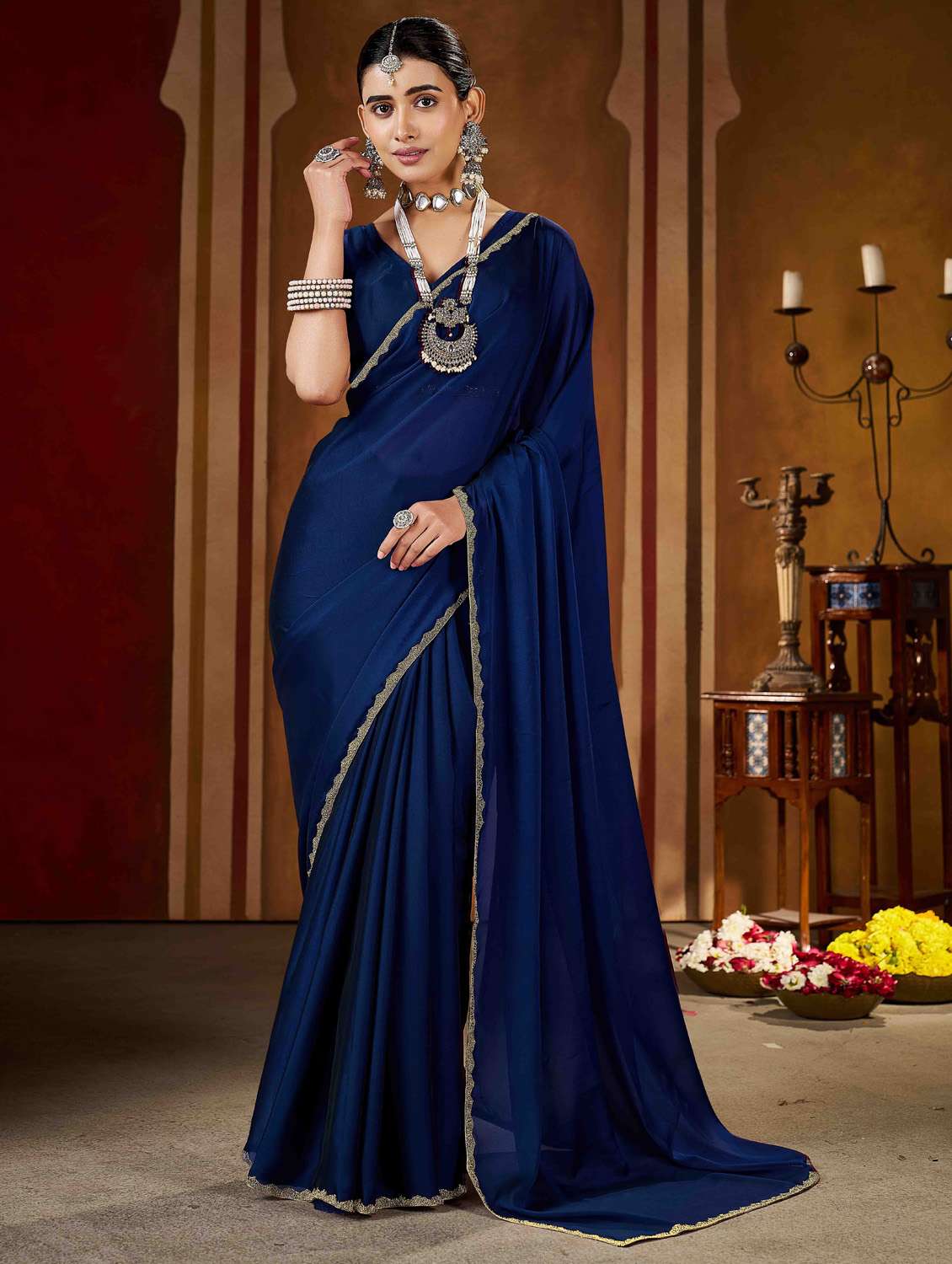 women solid with work embellished saree with blouse