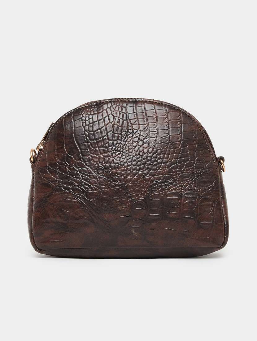 women brown textured sling bag