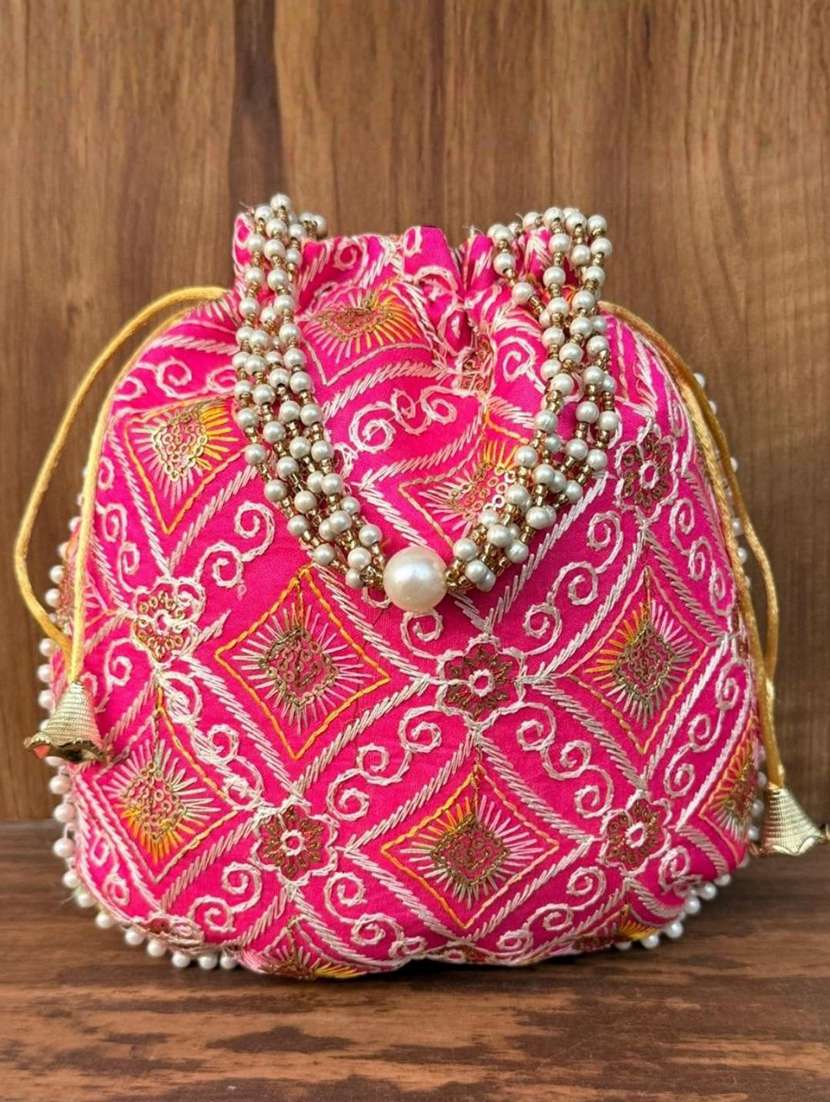 women solid with work embroidered potli