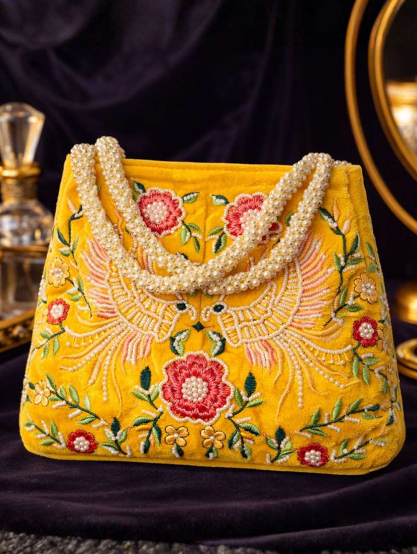 women solid with work embroidered potli