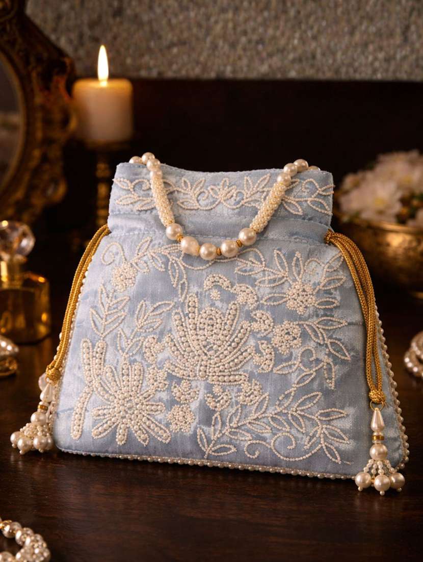 women solid with work embellished potli