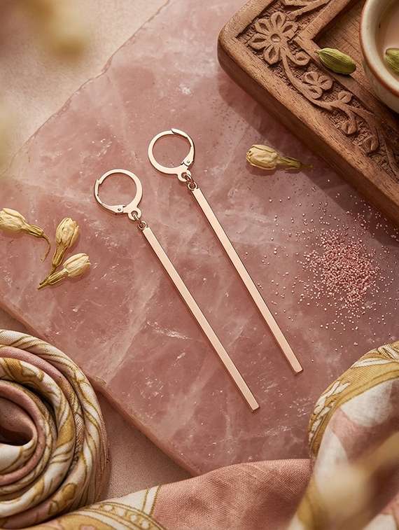 women gold brass jhumka earring