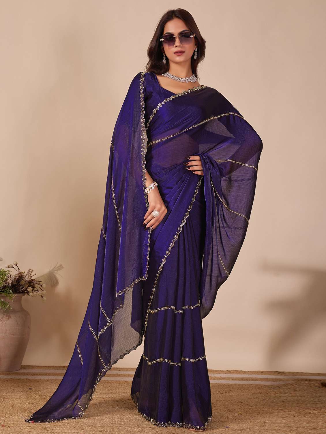 women solid with work embellished saree