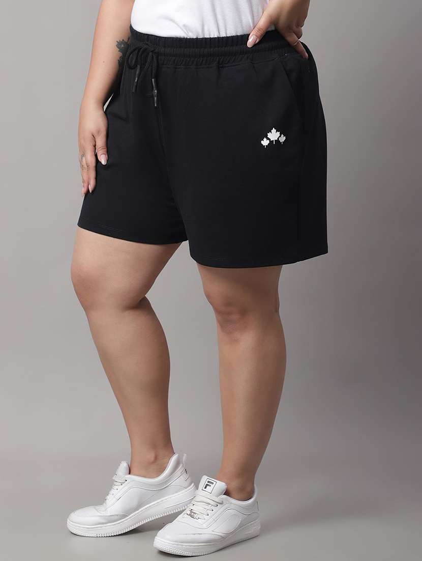 women solid mid rise regular sports shorts