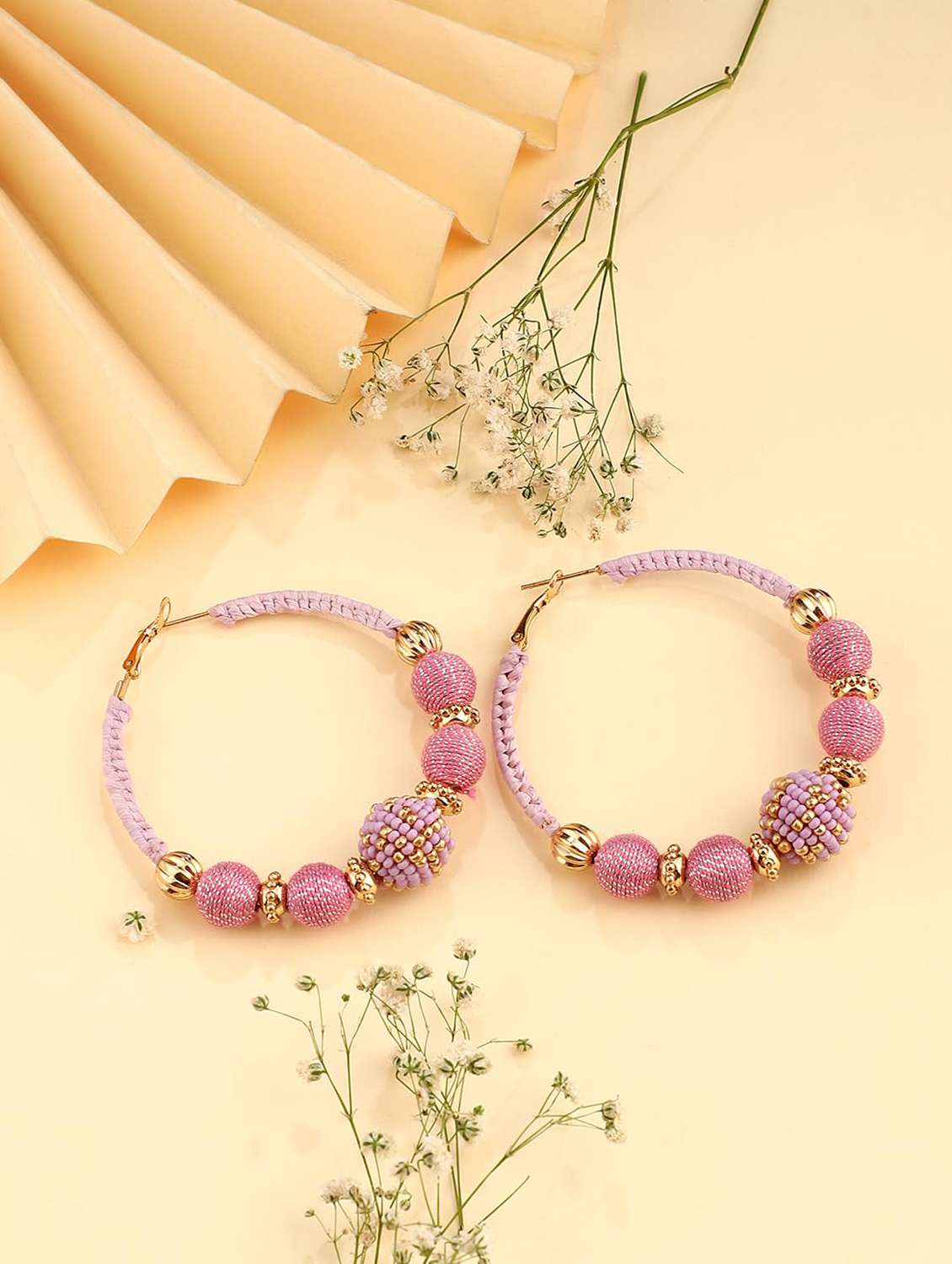 lavender thread hoop earring with metal beads