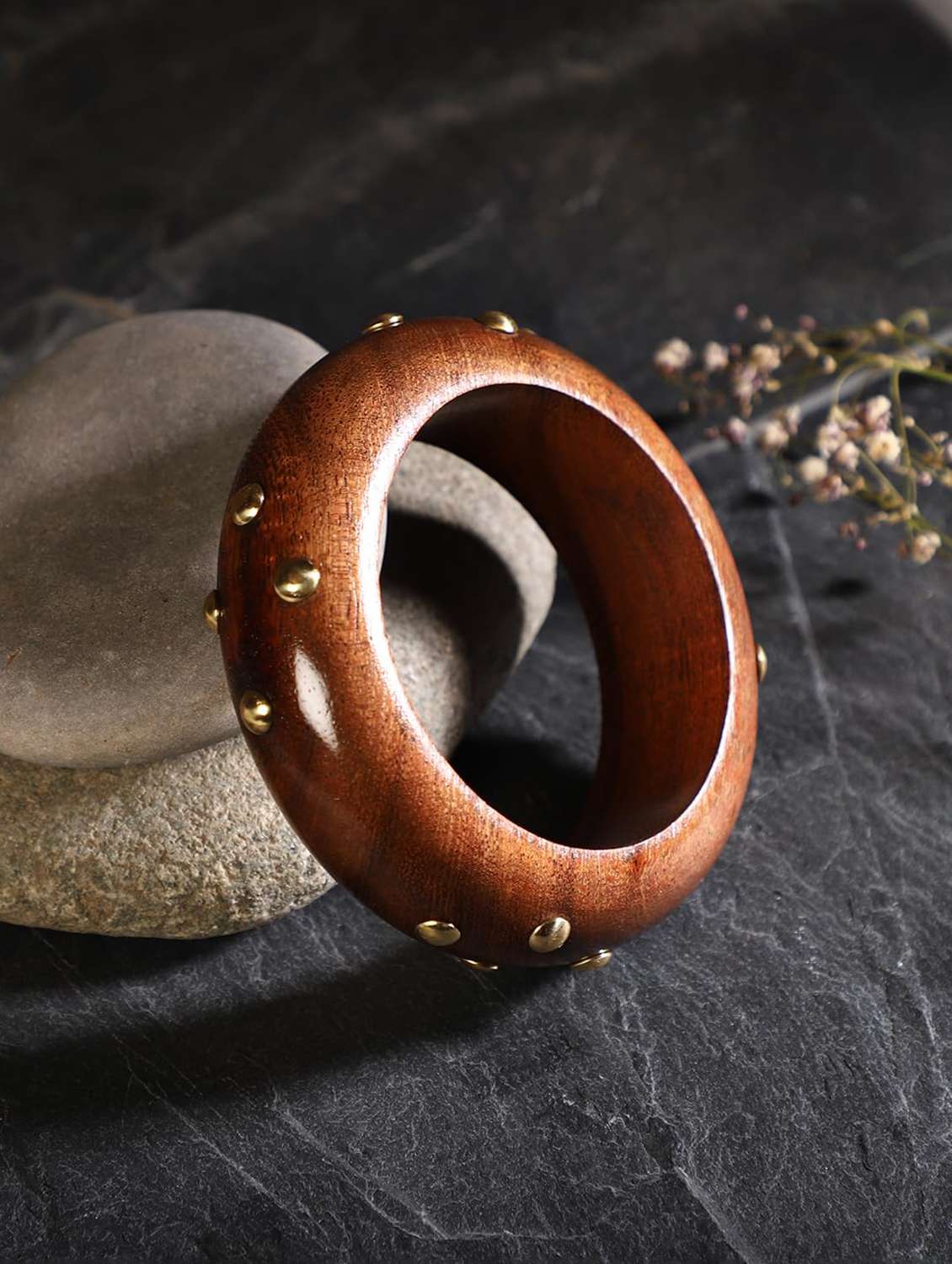 round brown wood bracelet with gold stud accents
