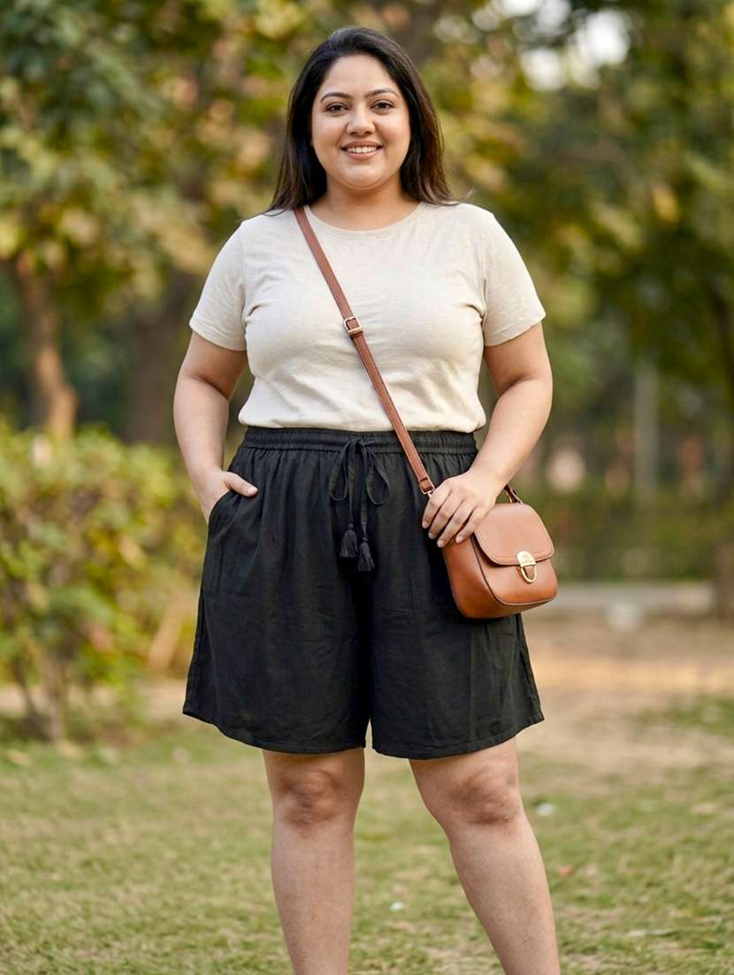 women solid mid rise regular shorts