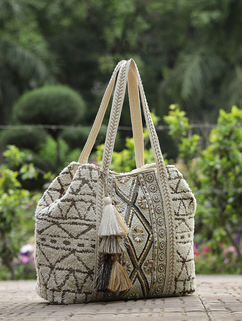 geometric pattern cotton canvas hobo bag with embellishment and button closure
