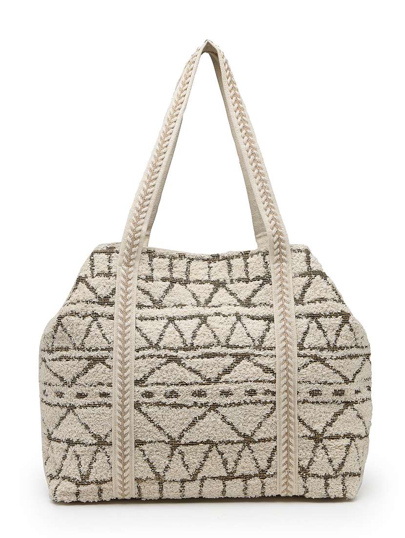 geometric pattern cotton canvas hobo bag with embellishment and button closure - 22541935 -  Standard Image - 1