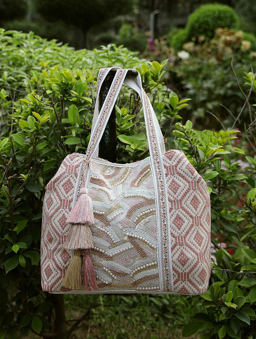 pink cotton canvas aztec beaded hobo bag with button closure