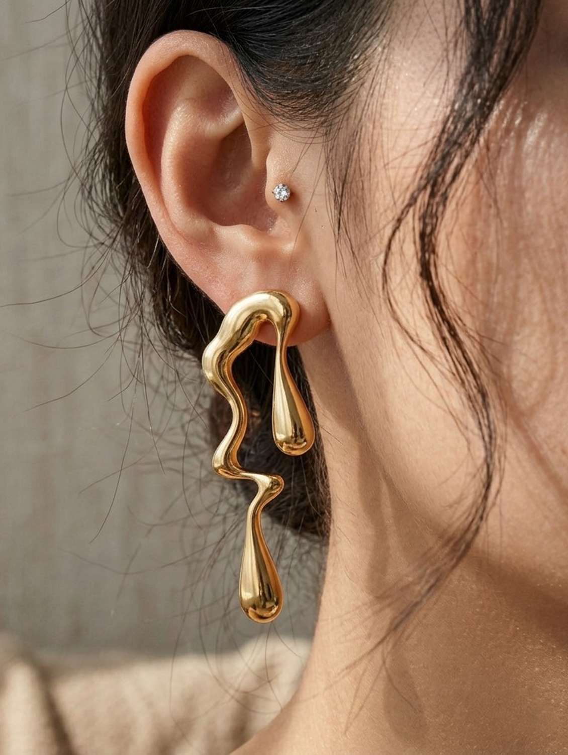women gold drop earrings