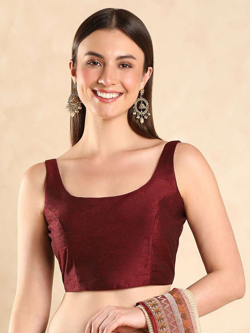 women solid sleeveless stitched blouse
