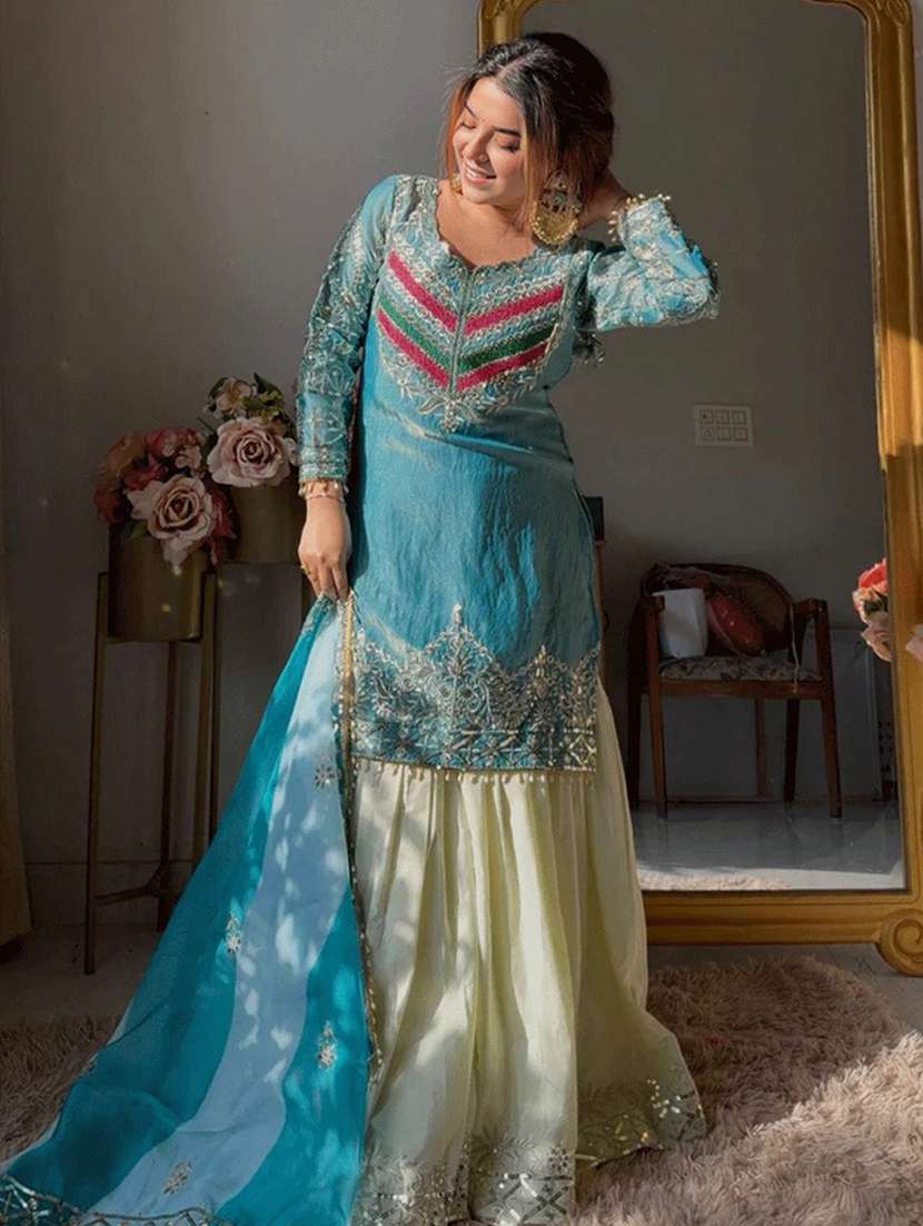 women embroidered long sleeves kurta sharara set