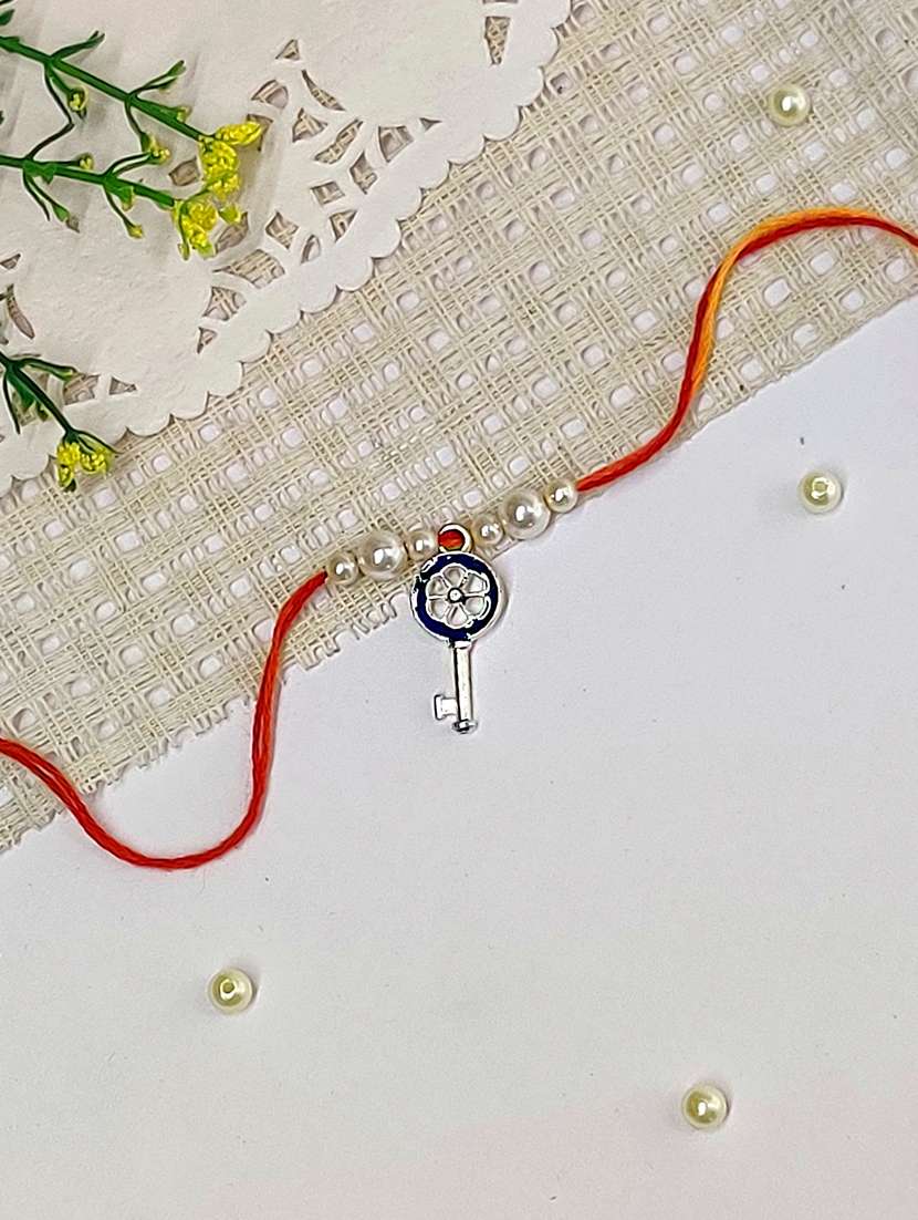 the magic wand trendy key figure rakhi with pearls embelishement - 22598314 -  Standard Image - 1