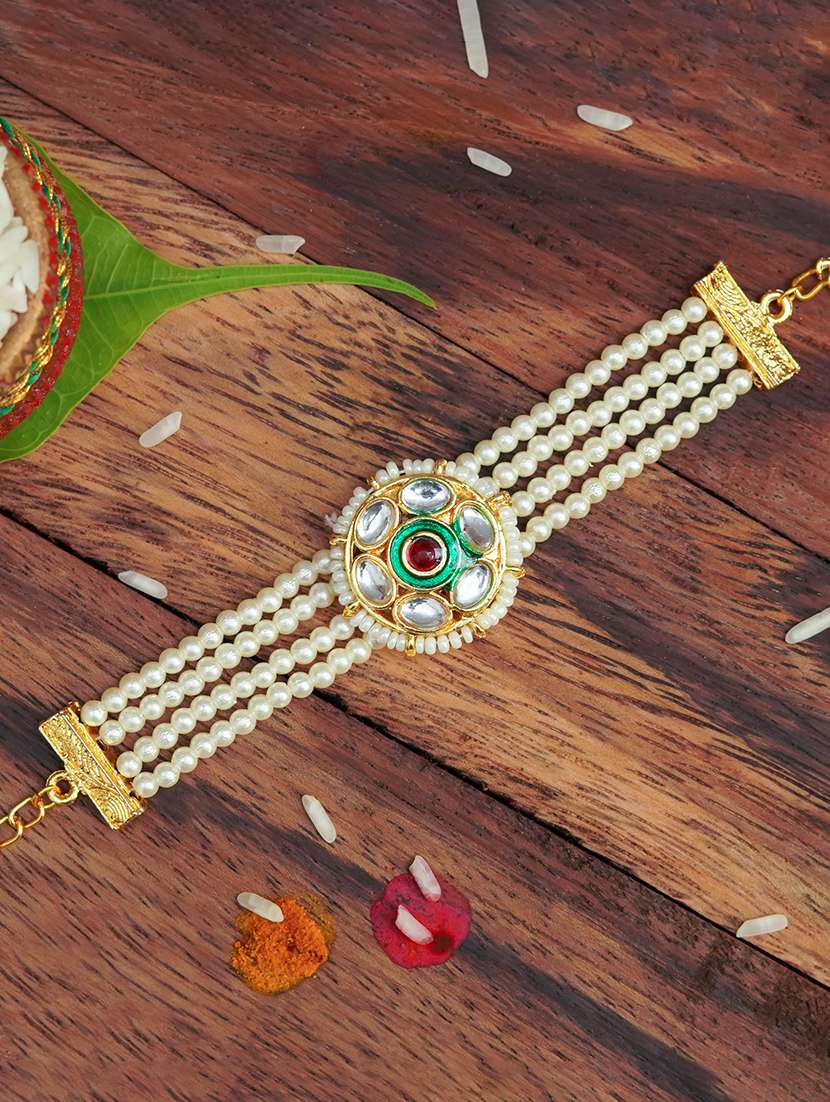 the magic wand traditional handmade mini pearl kundan bracelet rakhi - 22598324 -  Standard Image - 1