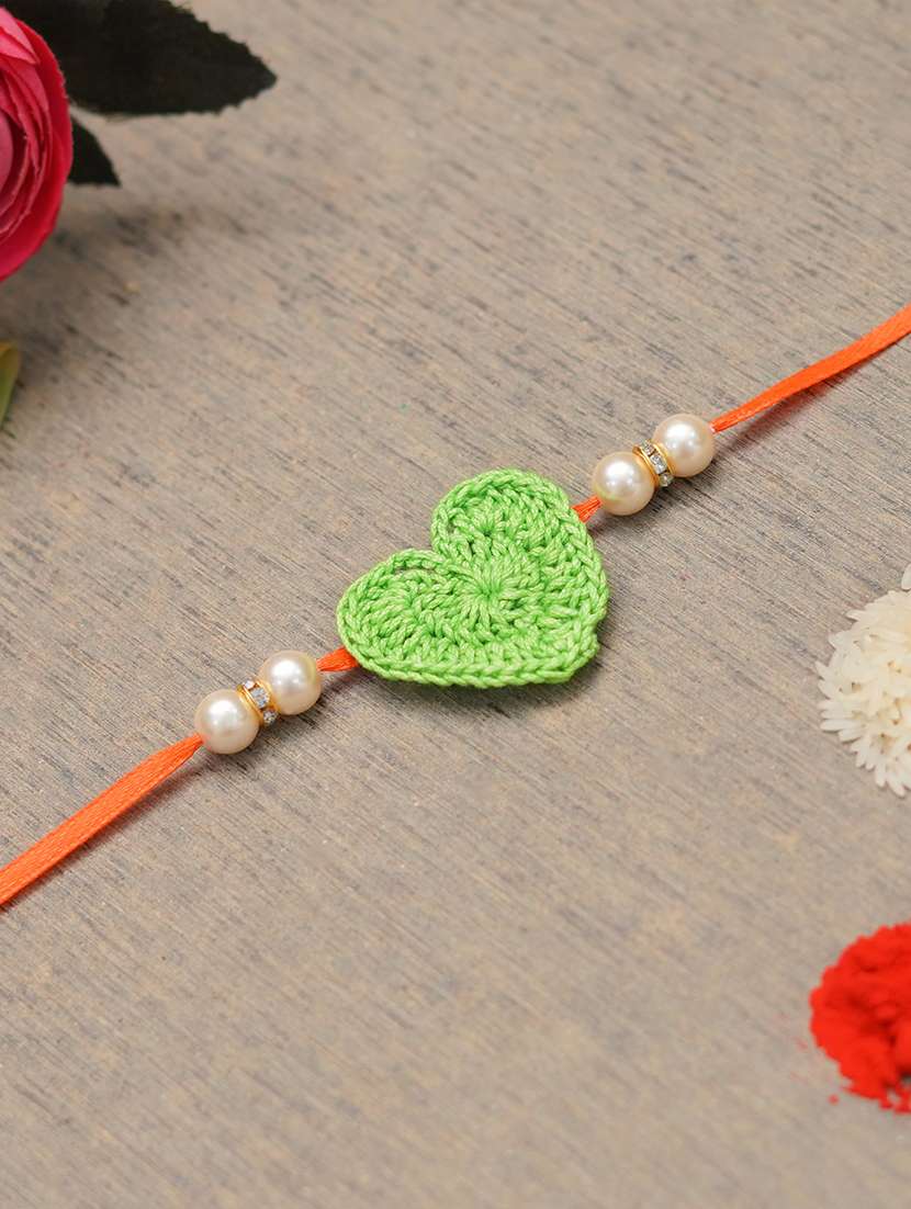 the magic wand cute heart applique pearl detailing handmade crochet rakhi - 22603846 -  Standard Image - 1