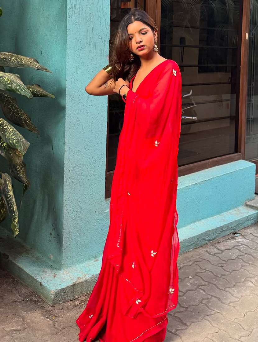 women solid with work embellished saree with blouse