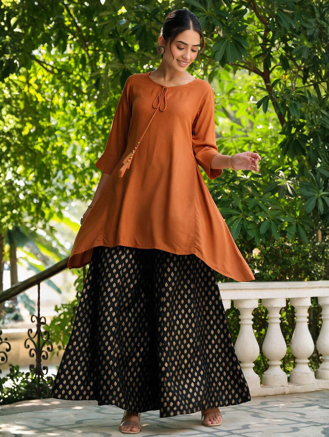 women solid three quarter sleeves asymmetric kurta