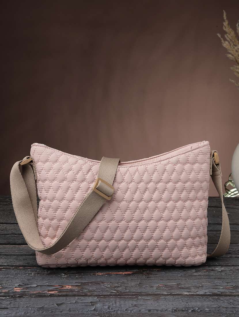 women textured sling bag with adjustable strap