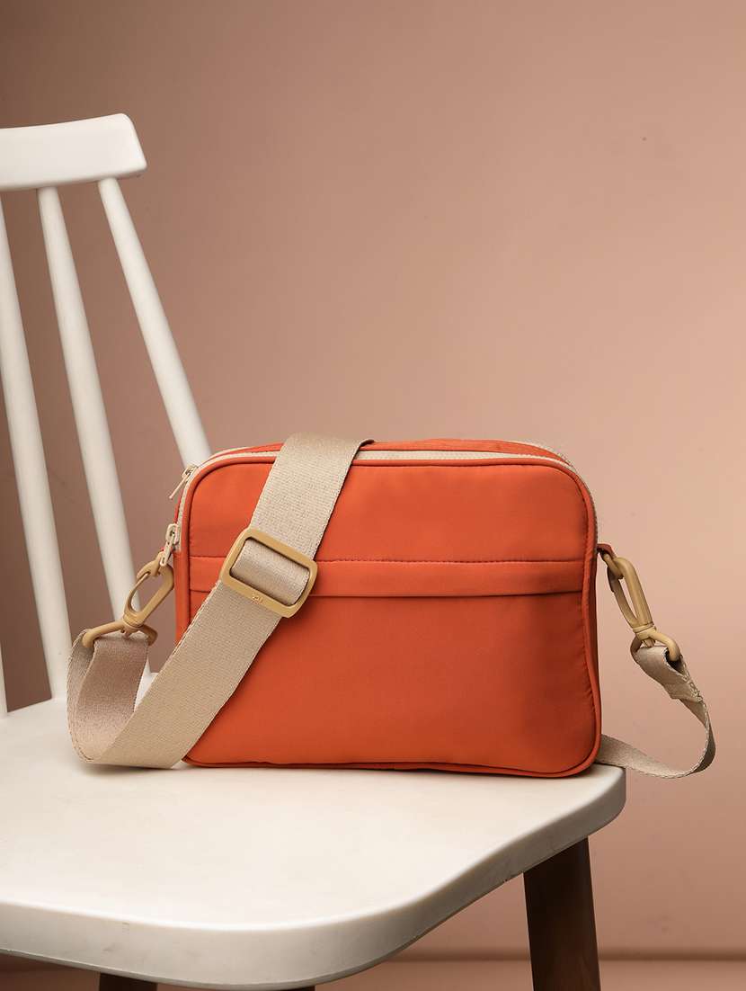 women solid sling bag with adjustable strap