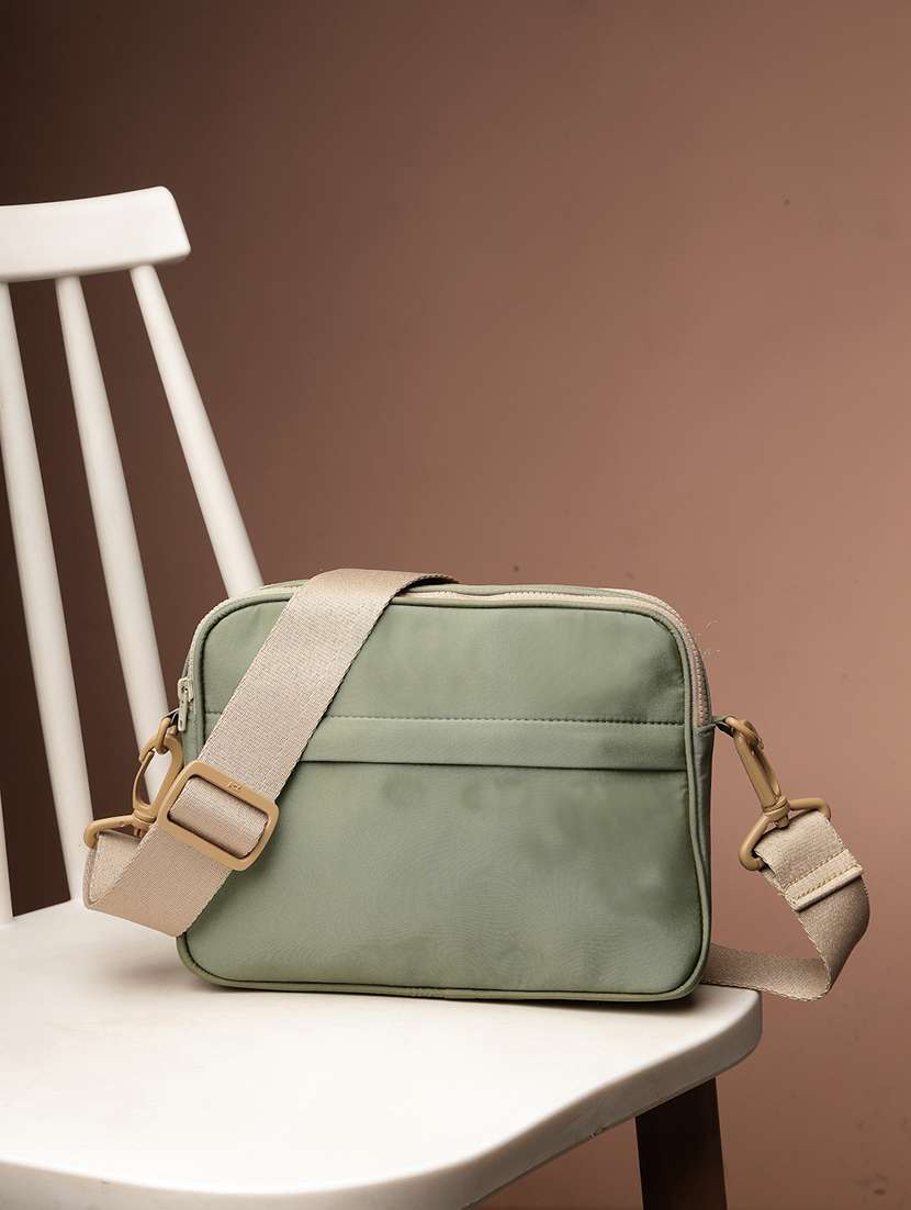 women solid sling bag with adjustable strap