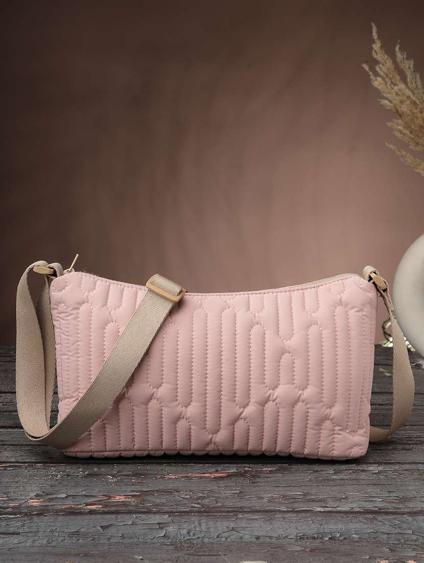 women textured sling bag with adjustable strap