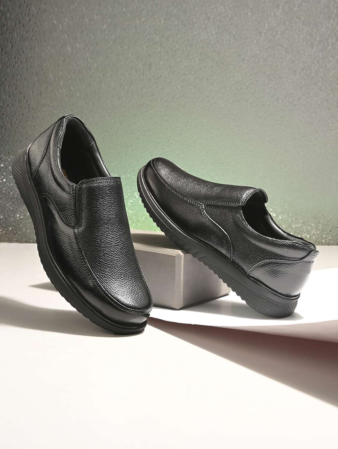 men textured slip on formal shoes