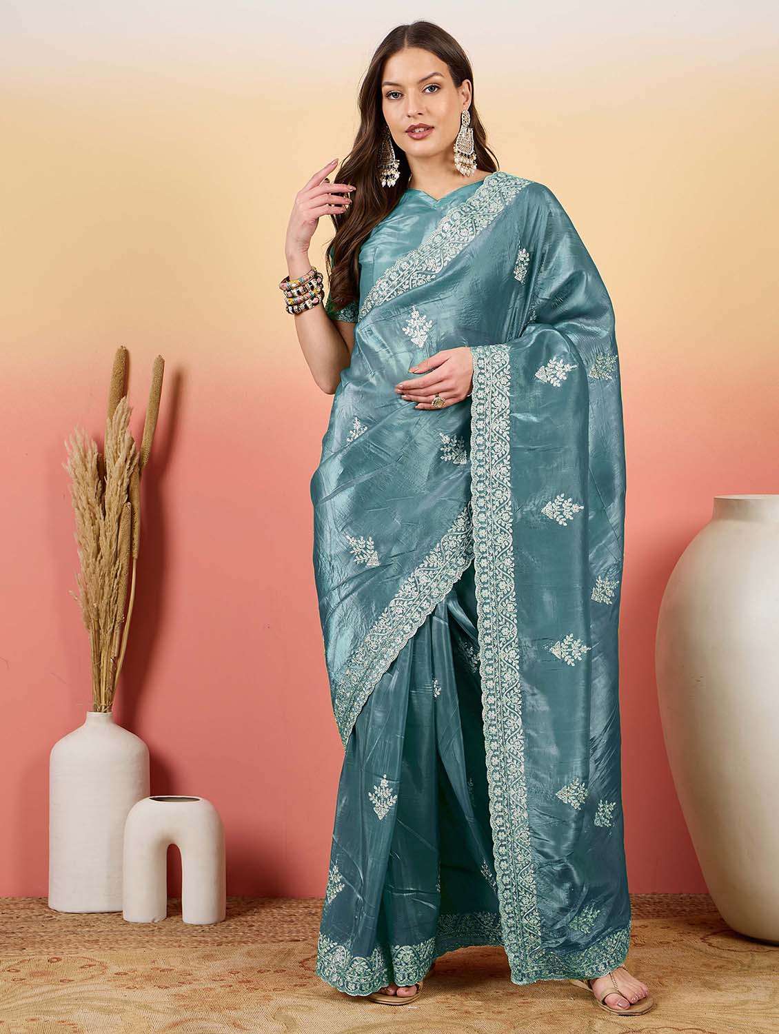 women solid with work embroidered saree with blouse