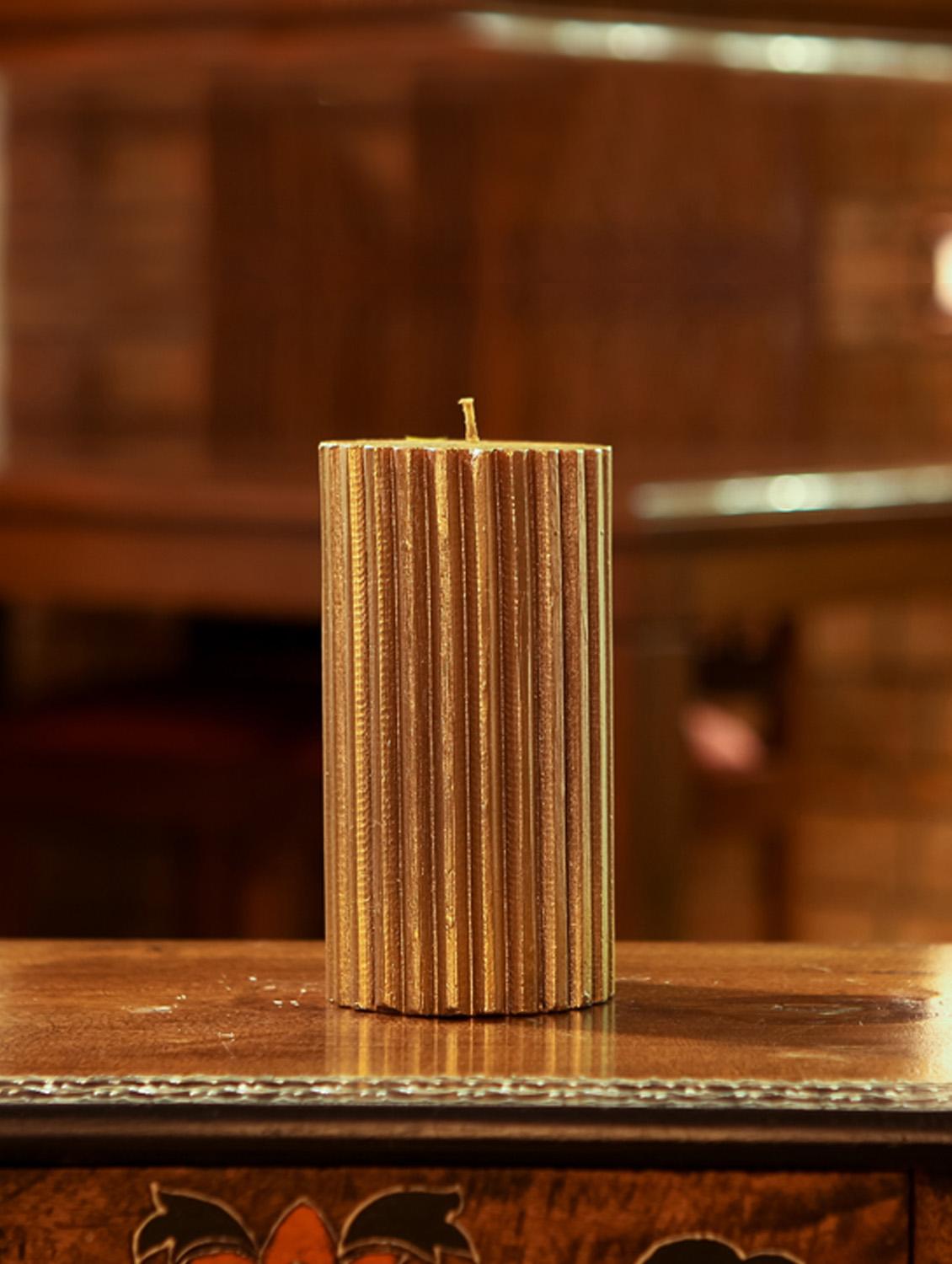 antique gold ribbed candle