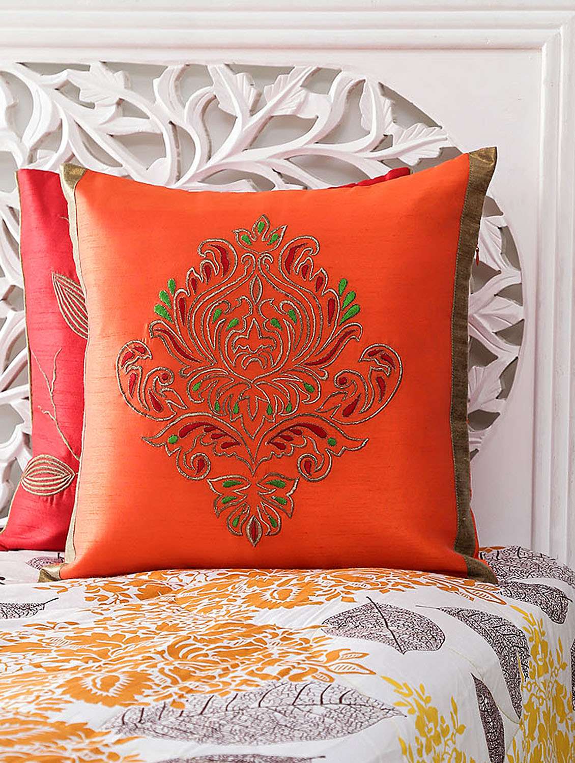 red  embroidered cushion cover