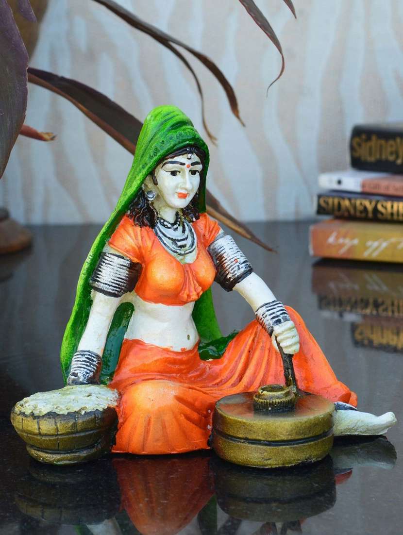 rajasthani lady using flour machine